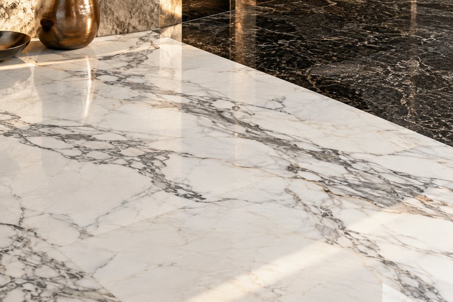 White veined marble and dark granite surfaces